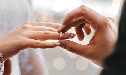 photo of wedding ring on hands