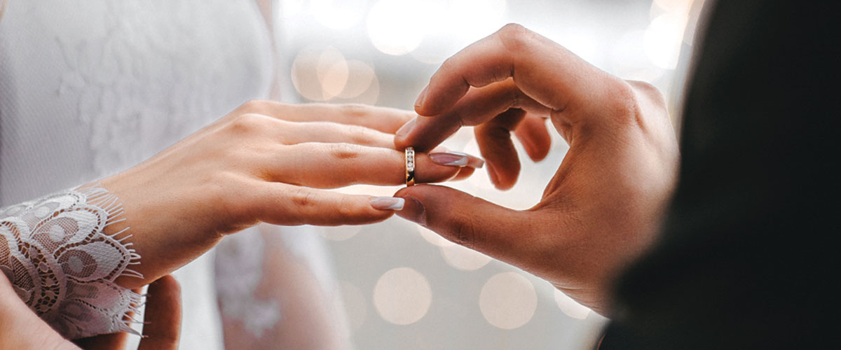 photo of wedding ring on hands