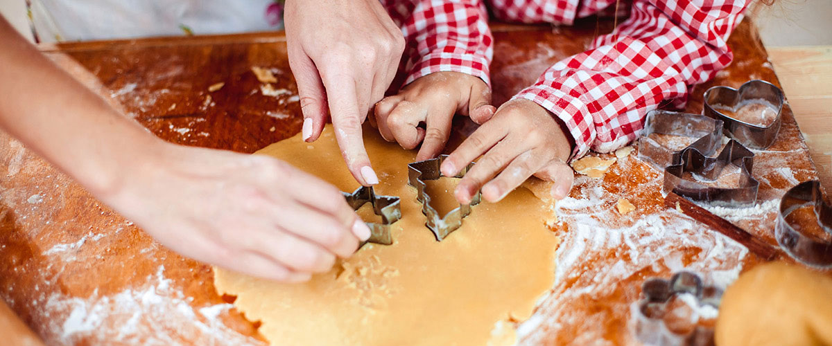 parent and child making cookies