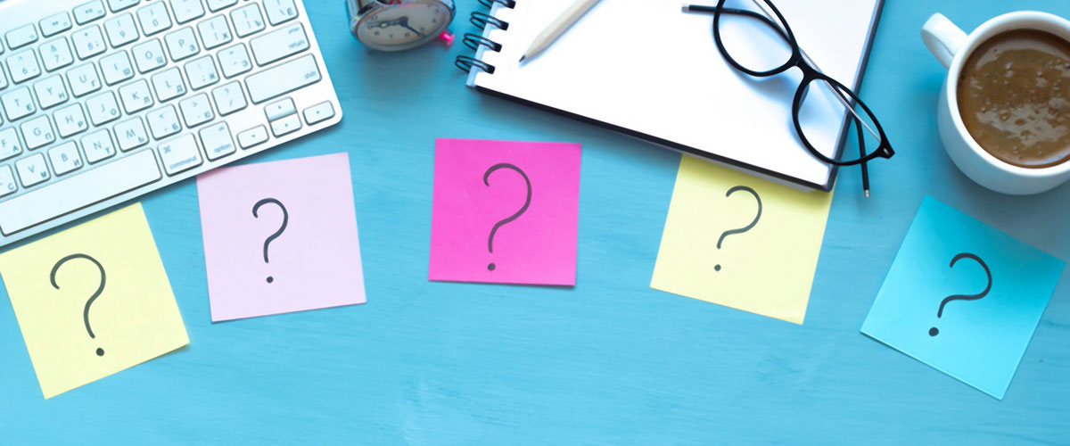 5 question mark sticky notes on desk