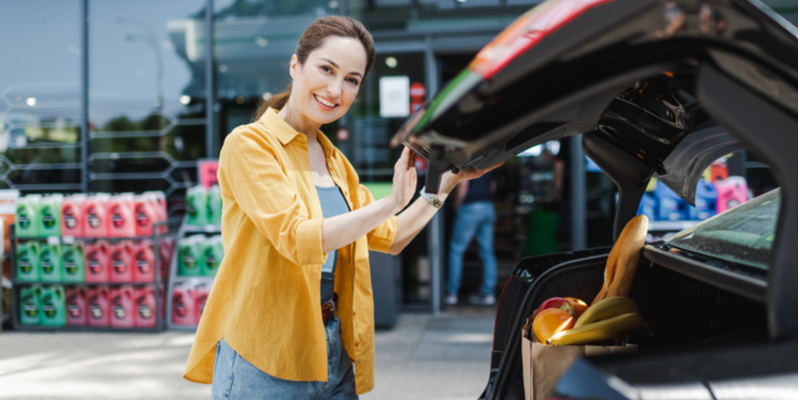 Woman standing near car