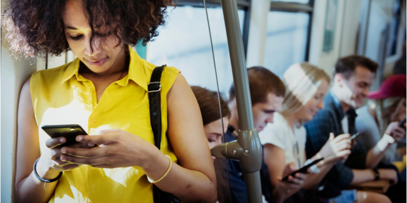 Women tracking money order on phone