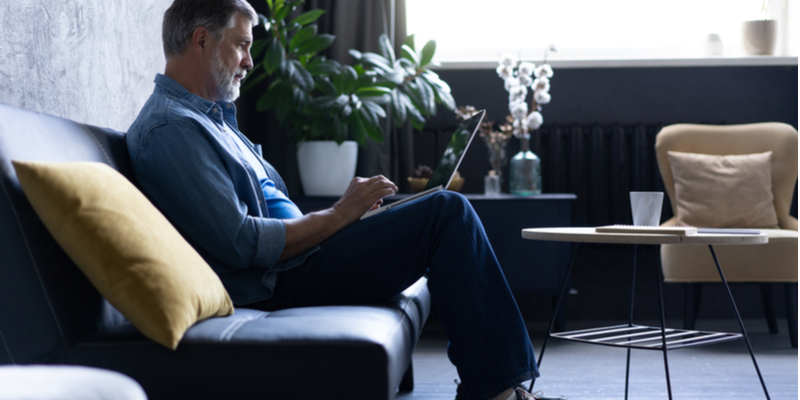 Man searching online bad credit line of credit options