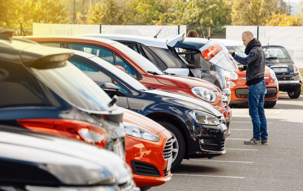 Man looking at cars