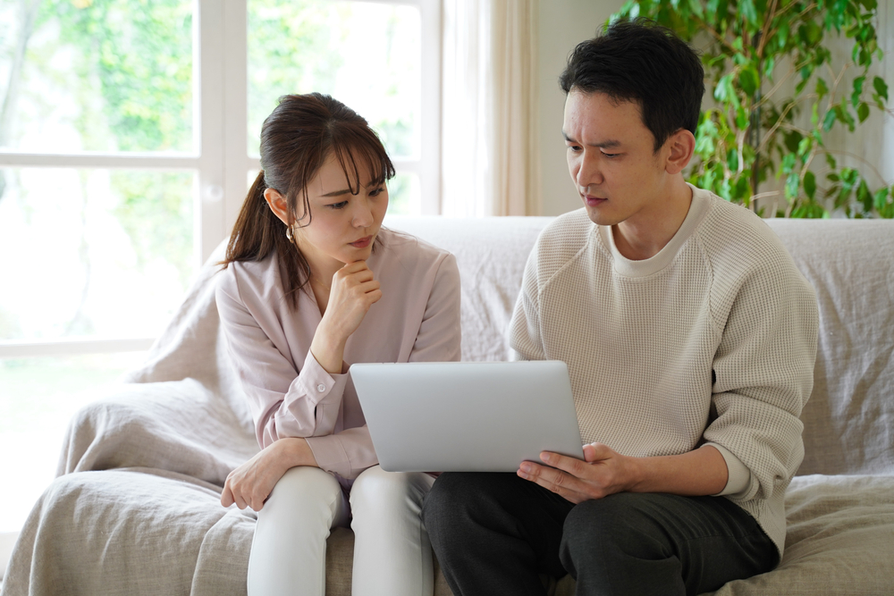 Couple checking credit score on their computer