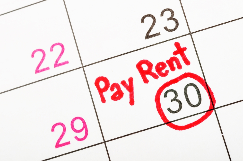 "Pay rent" written in red marker on a calendar.