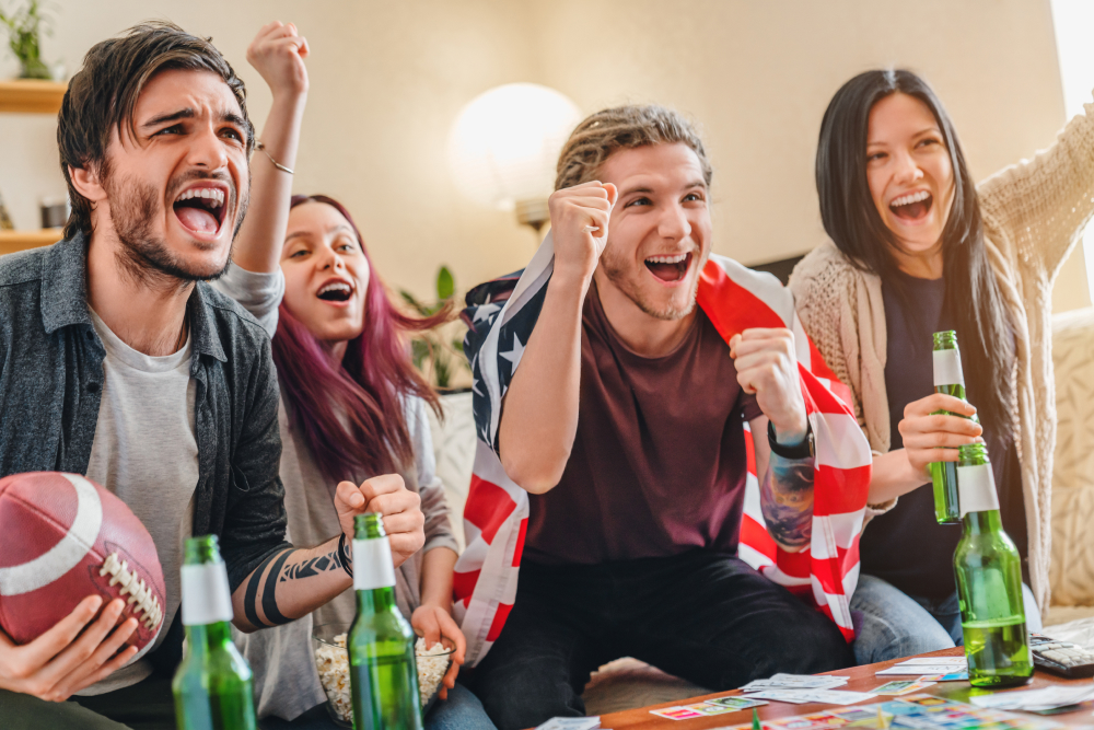 Group of friends sport fans watching rugby match and celebrating winning