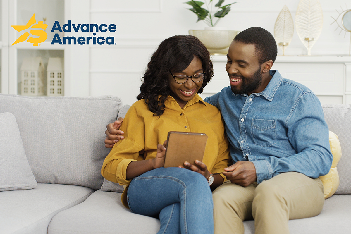 couple looking at a tablet together