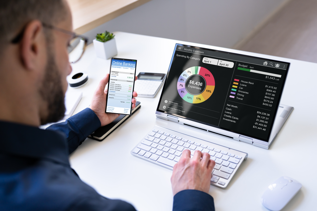 man looks at a budget tracker