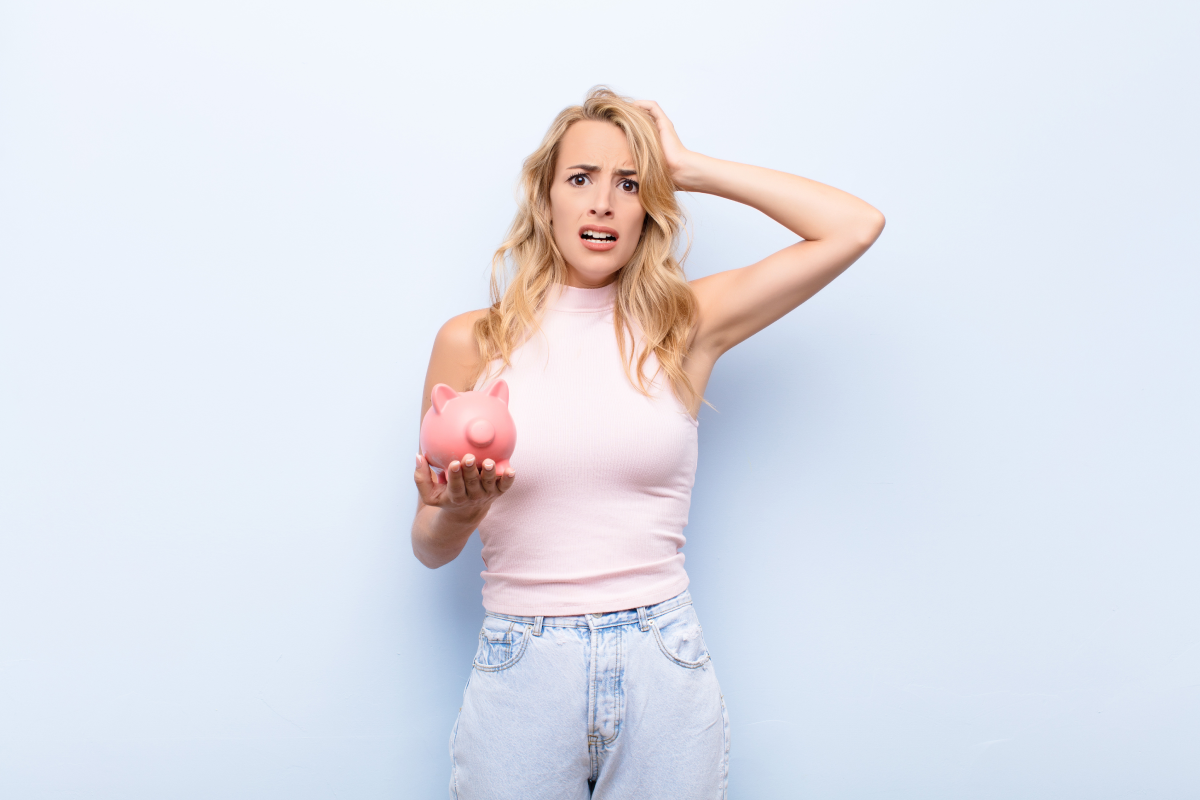 stressed woman with piggy bank