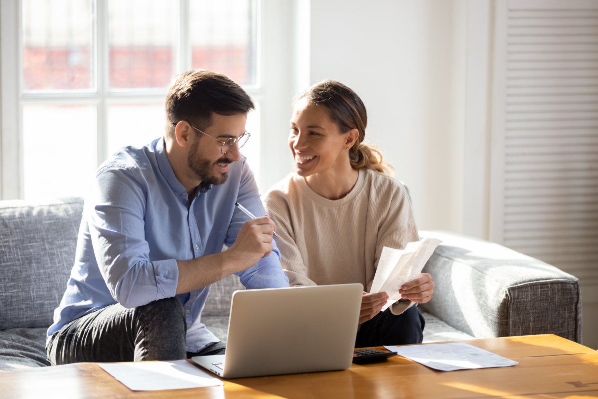 Couple looking at their computer