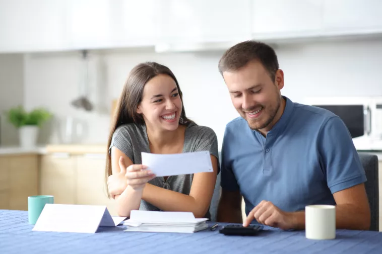 couple looks at a check