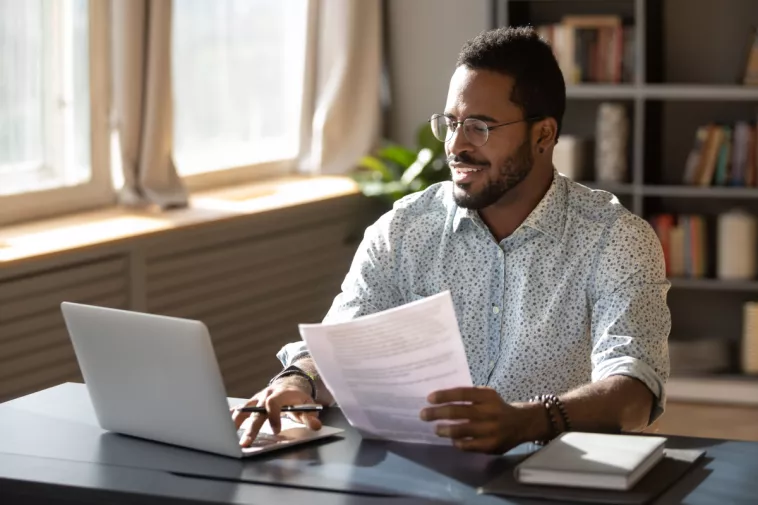 man looks at documents