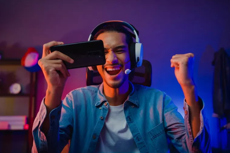 man psyched about phone game
