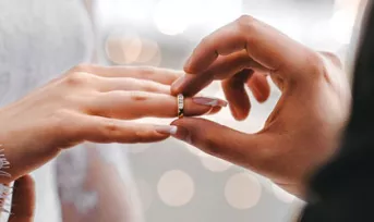 photo of wedding ring on hands