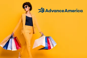 Happy woman with many shopping bags