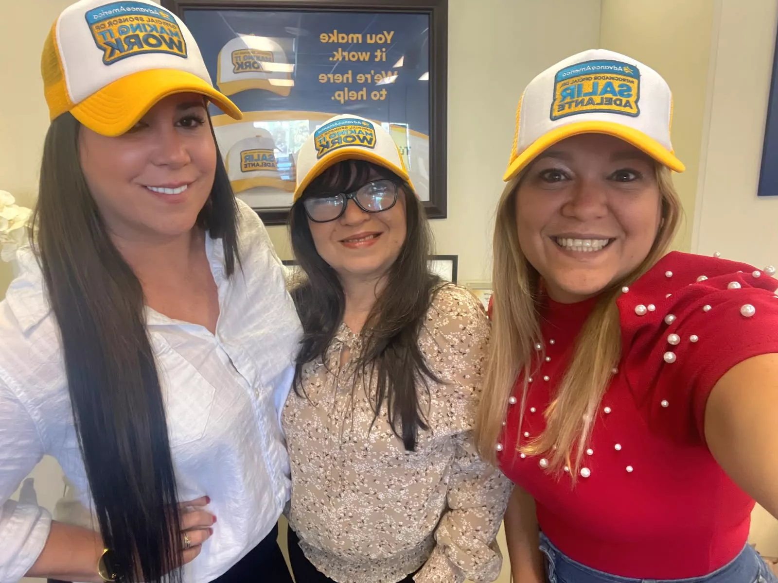 3 woman smile in trucker hats