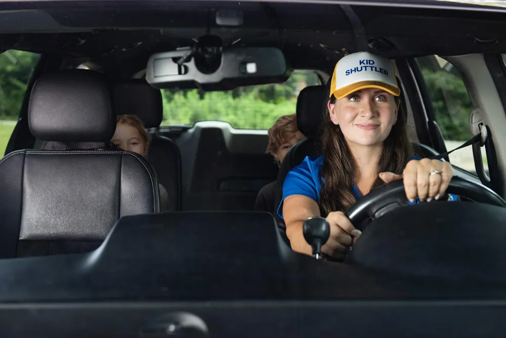 Kat driving in the car with kids